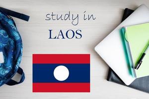 Study in Laos. Background with notepad, laptop and backpack. Education concept. photo