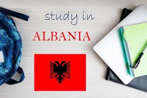 Study in Albania. Background with notepad, laptop and backpack. Education concept. photo