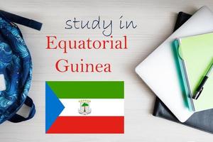 Study in Equatorial Guinea. Background with notepad, laptop and backpack. Education concept. photo