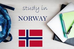 Study in Norway. Background with notepad, laptop and backpack. Education concept. photo