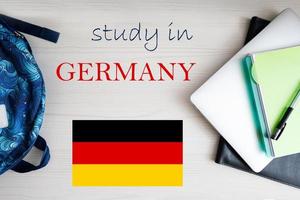 Study in Germany. Background with notepad, laptop and backpack. Education concept. photo