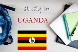Study in Uganda. Background with notepad, laptop and backpack. Education concept. photo