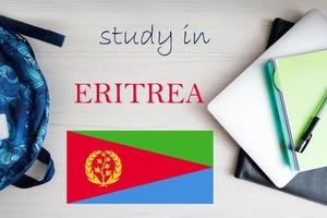 Study in Eritrea. Background with notepad, laptop and backpack. Education concept. photo
