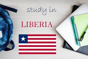 Study in Liberia. Background with notepad, laptop and backpack. Education concept. photo