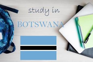 Study in Botswana. Background with notepad, laptop and backpack. Education concept. photo