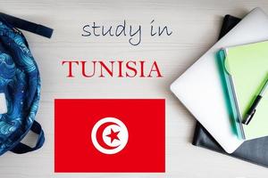 Study in Tunisia. Background with notepad, laptop and backpack. Education concept. photo