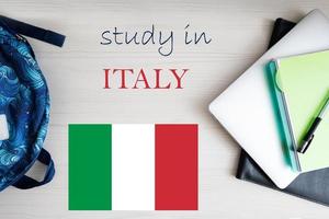 Study in Italy. Background with notepad, laptop and backpack. Education concept. photo