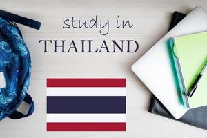 Study in Thailand. Background with notepad, laptop and backpack. Education concept. photo