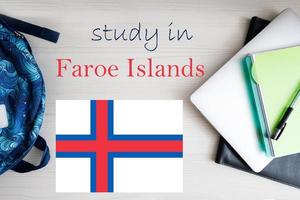 Study in Faroe Islands. Background with notepad, laptop and backpack. Education concept. photo