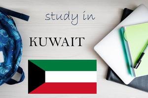 Study in Kuwait. Background with notepad, laptop and backpack. Education concept. photo