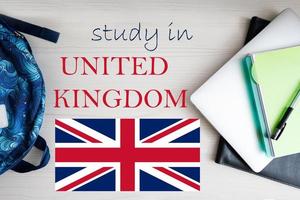 Study in United Kingdom. Background with notepad, laptop and backpack. Education concept. photo