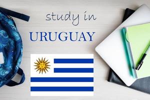 Study in Uruguay. Background with notepad, laptop and backpack. Education concept. photo