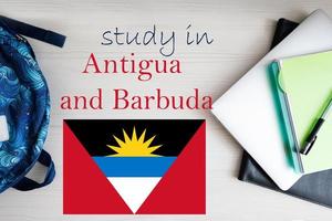 Study in Antigua and Barbuda. Background with notepad, laptop and backpack. Education concept. photo