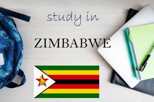 Study in Zimbabwe. Background with notepad, laptop and backpack. Education concept. photo