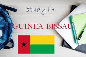 Study in Guinea-Bissau. Background with notepad, laptop and backpack. Education concept. photo