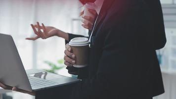 Financial analysts analyze business financial reports on a digital tablet planning investment project during a discussion at a meeting of corporate showing the results of their successful teamwork. video