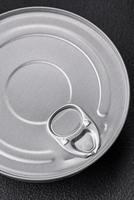 Tin metal can with canned food round shape with a key photo