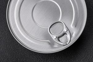 Tin metal can with canned food round shape with a key photo