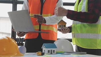 Construction and structure concept of Engineer or architect meeting for project working with partner and engineering tools on model building and blueprint in working site, contract for both companies. video