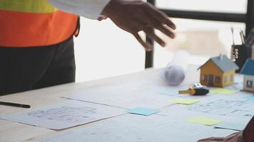 Construction and structure concept of Engineer or architect meeting for project working with partner and engineering tools on model building and blueprint in working site, contract for both companies. video