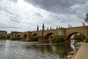 landscape Nuestra Senora del Pilar Cathedral Basilica view from the Ebro River in a spring day photo