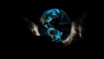 Shiny round world in human hands at night time. Earth Day. Energy saving concept. photo
