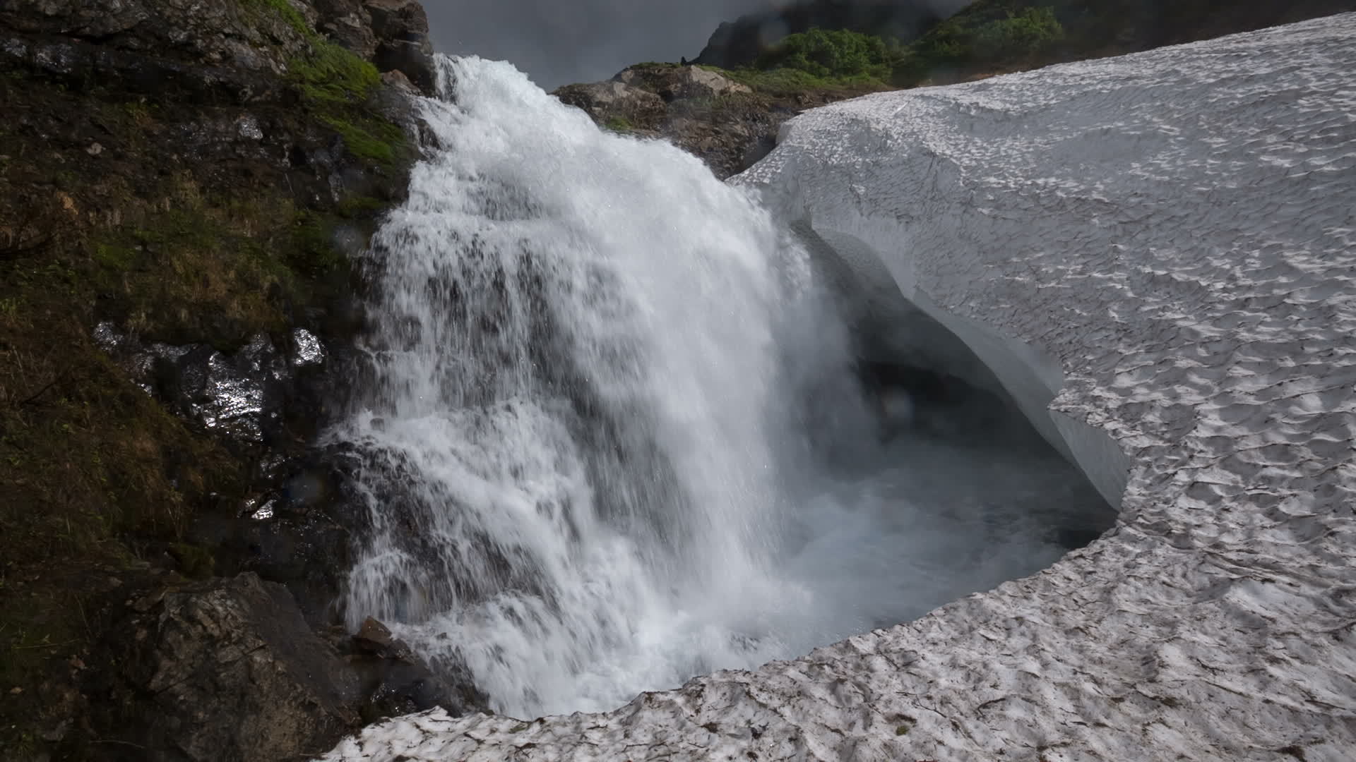 Bottom view of high waterfall falling in snowfield 22654900 Stock Video