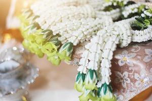 Flower garlands on a gold tray in tradition Thai wedding ceremony day. Jasmine garland photo