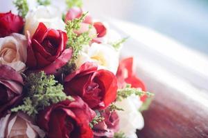 Beautiful rose Flowers bouquet on vintage chair in wedding ceremony. Valentine day photo