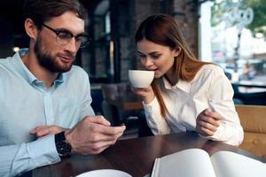 young couple in cafe work colleagues breakfast lifestyle photo