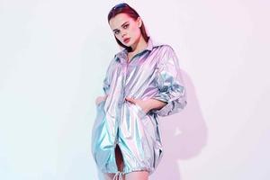 woman in silver jacket fashion disco posing studio photo