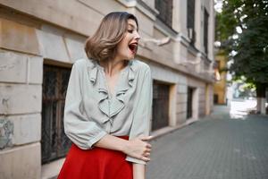 emotional woman outdoors walk posing near building photo