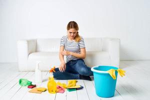 Woman at home near couch rendering services at home interior photo