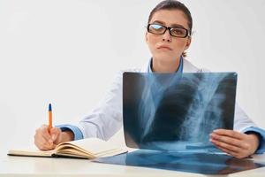 female doctor in white coat x-ray diagnostics photo