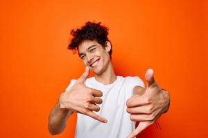 Cheerful man white t-shirt gestures with hand emotions fashion photo