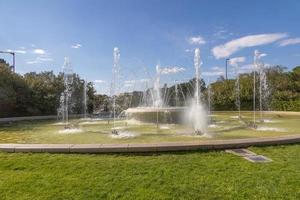 urban landscape of the spanish city of Zaragoza on a warm spring day with fountains in the landmark park photo