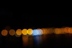 black original hexagonal bokeh abstract background with light flares photo