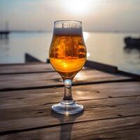 A beer glass on a wooden table photo