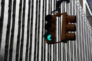 traffic light new york manhattan skyscrapers view from the street to the top of the building on sunny clear day photo