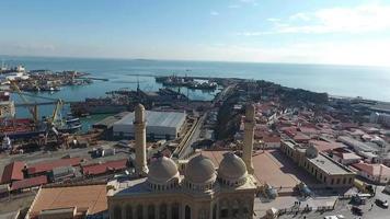 The aerial view of a magnificent mosque situated by the sea video