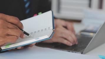 Financial analysts analyze business financial reports on a digital tablet planning investment project during a discussion at a meeting of corporate showing the results of their successful teamwork. video