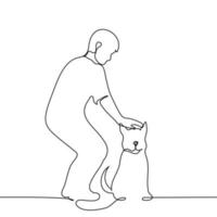 man petting a sitting dog on the head - one line drawing vector. concept dog lover, petting a dog vector