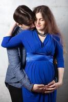 Pregnant wife with husband. Man and woman are expecting a baby. photo