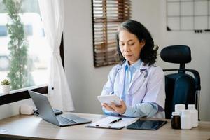 Medical technology concept. Doctor working with mobile phone and stethoscope in modern office photo