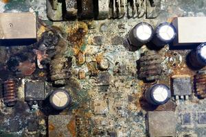 electronics board flooded with water with traces of corrosion photo