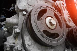 car engine close-up, crankshaft pulley photo