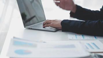 Financial analysts analyze business financial reports on a digital tablet planning investment project during a discussion at a meeting of corporate showing the results of their successful teamwork. video