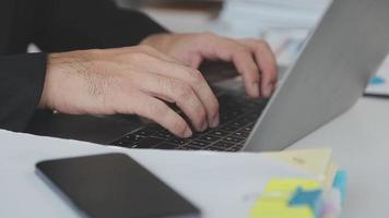 Financial analysts analyze business financial reports on a digital tablet planning investment project during a discussion at a meeting of corporate showing the results of their successful teamwork. video