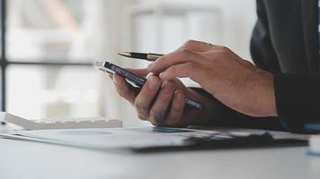 Financial analysts analyze business financial reports on a digital tablet planning investment project during a discussion at a meeting of corporate showing the results of their successful teamwork. video
