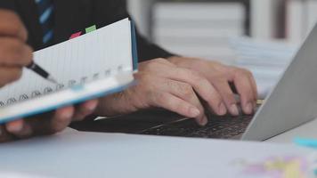 Financial analysts analyze business financial reports on a digital tablet planning investment project during a discussion at a meeting of corporate showing the results of their successful teamwork. video